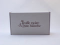 Box Truffe Noire & Patte Blanche fermée, carton blanc au logo marron