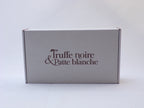 Box Truffe Noire & Patte Blanche fermée, carton blanc au logo marron