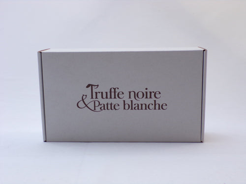 Box Truffe Noire & Patte Blanche fermée, carton blanc au logo marron